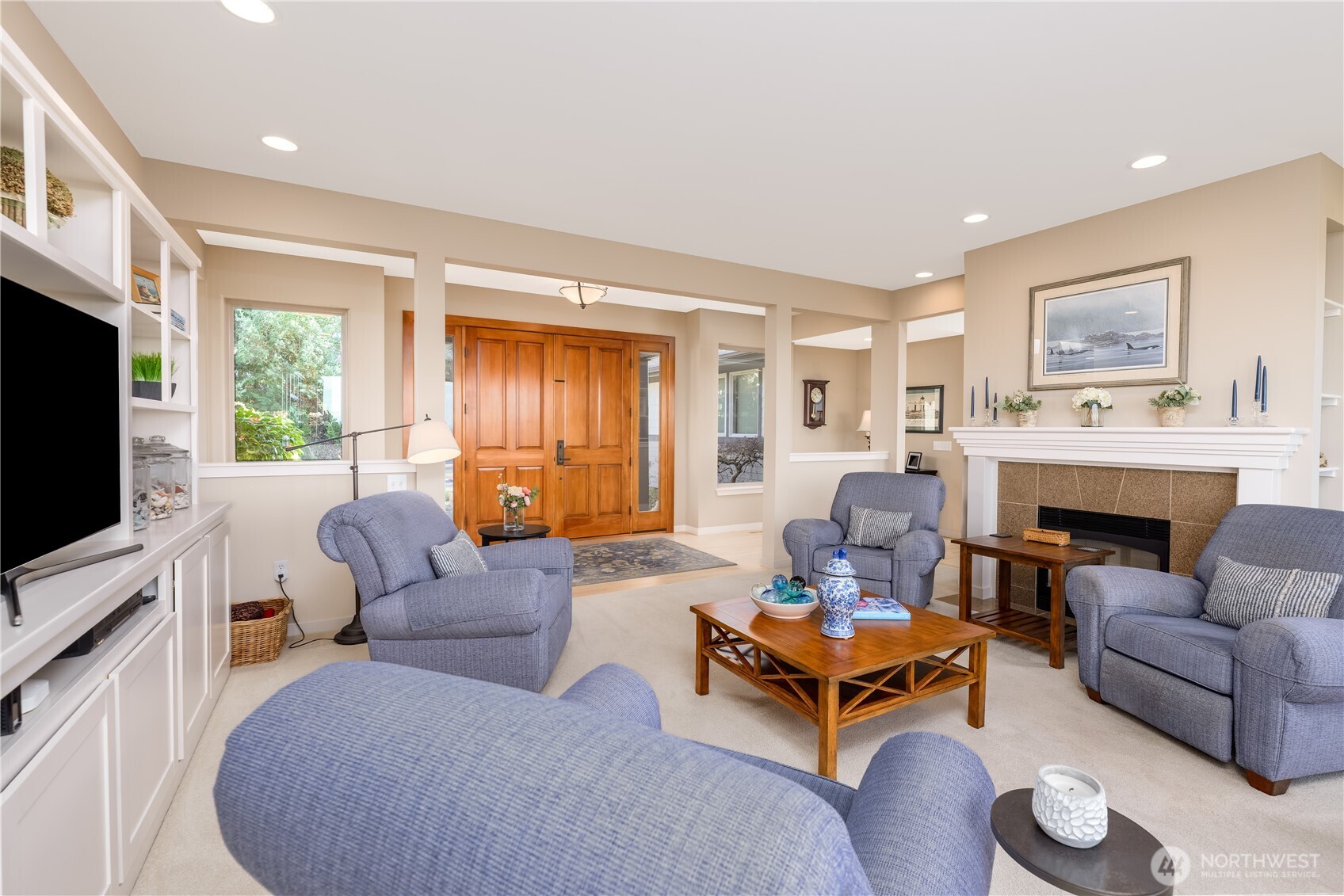 771 Brigadoon Boulevard Sequim, WA 98382 - Photo 15 of 40 a living room with furniture a fireplace and a flat screen tv