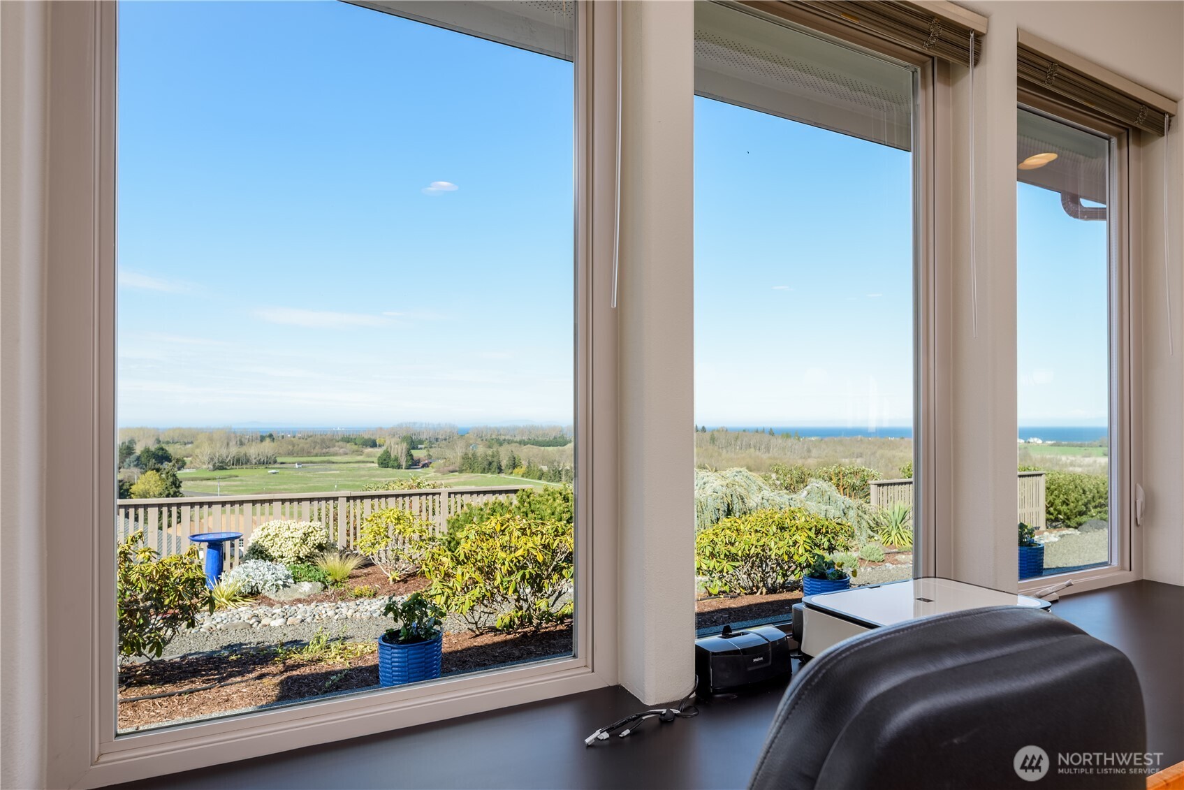 771 Brigadoon Boulevard Sequim, WA 98382 - Photo 20 of 40 a room with a bed and large windows