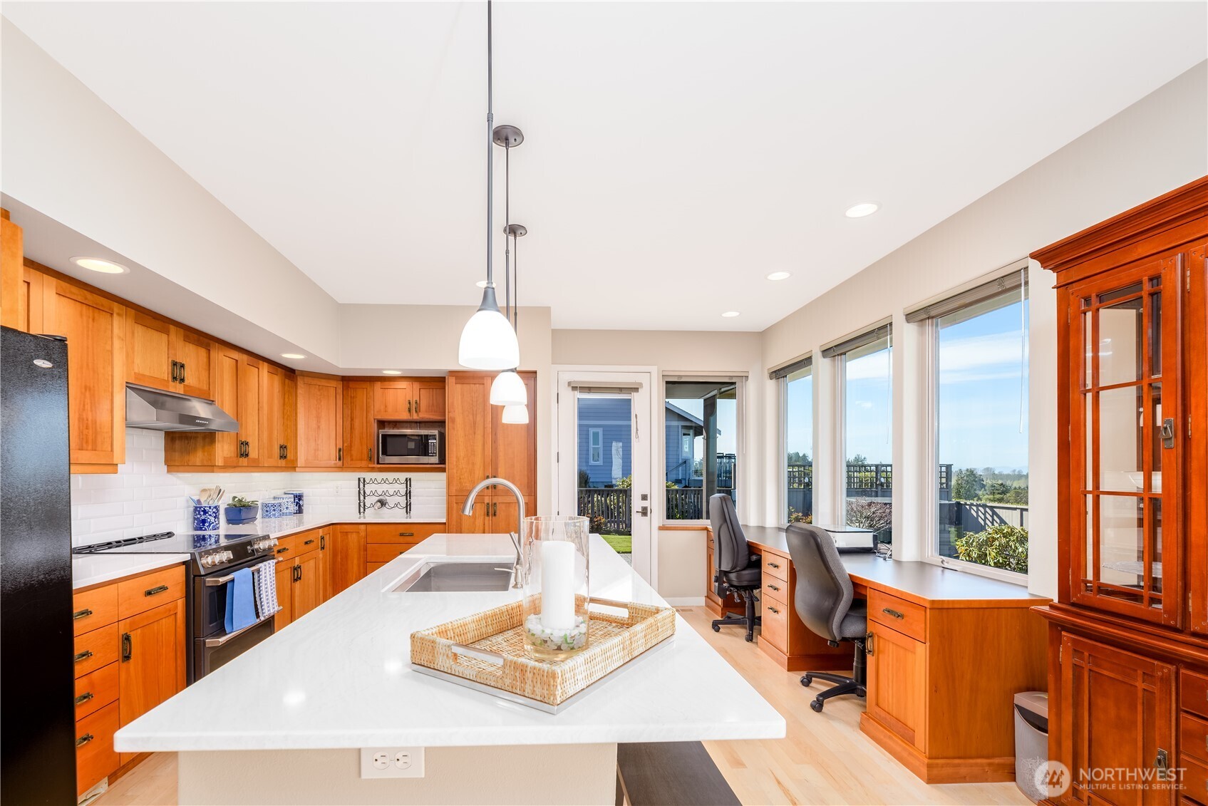 771 Brigadoon Boulevard Sequim, WA 98382 - Photo 23 of 40 a large kitchen with a large window and stainless steel appliances