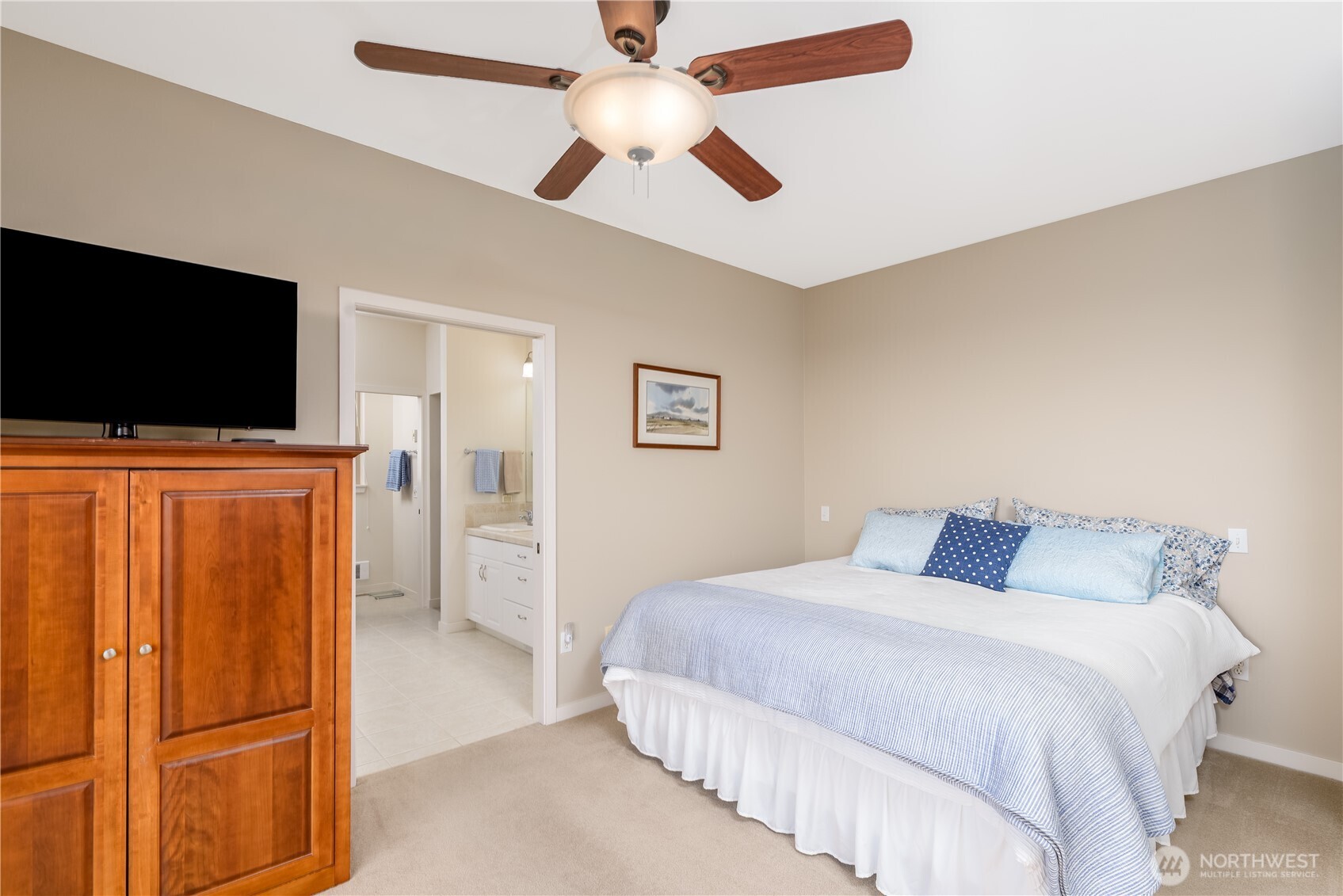 771 Brigadoon Boulevard Sequim, WA 98382 - Photo 28 of 40 a bedroom with a bed and a flat screen tv