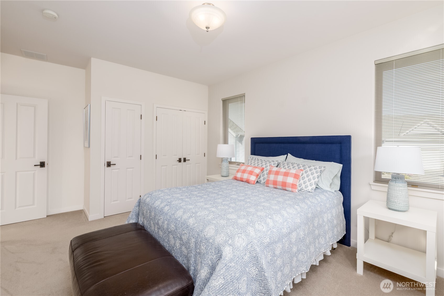 771 Brigadoon Boulevard Sequim, WA 98382 - Photo 35 of 40 a bedroom with a bed and a couch