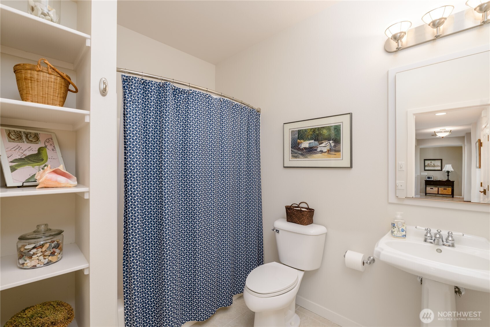 771 Brigadoon Boulevard Sequim, WA 98382 - Photo 36 of 40 a bathroom with a toilet a sink and shower curtain
