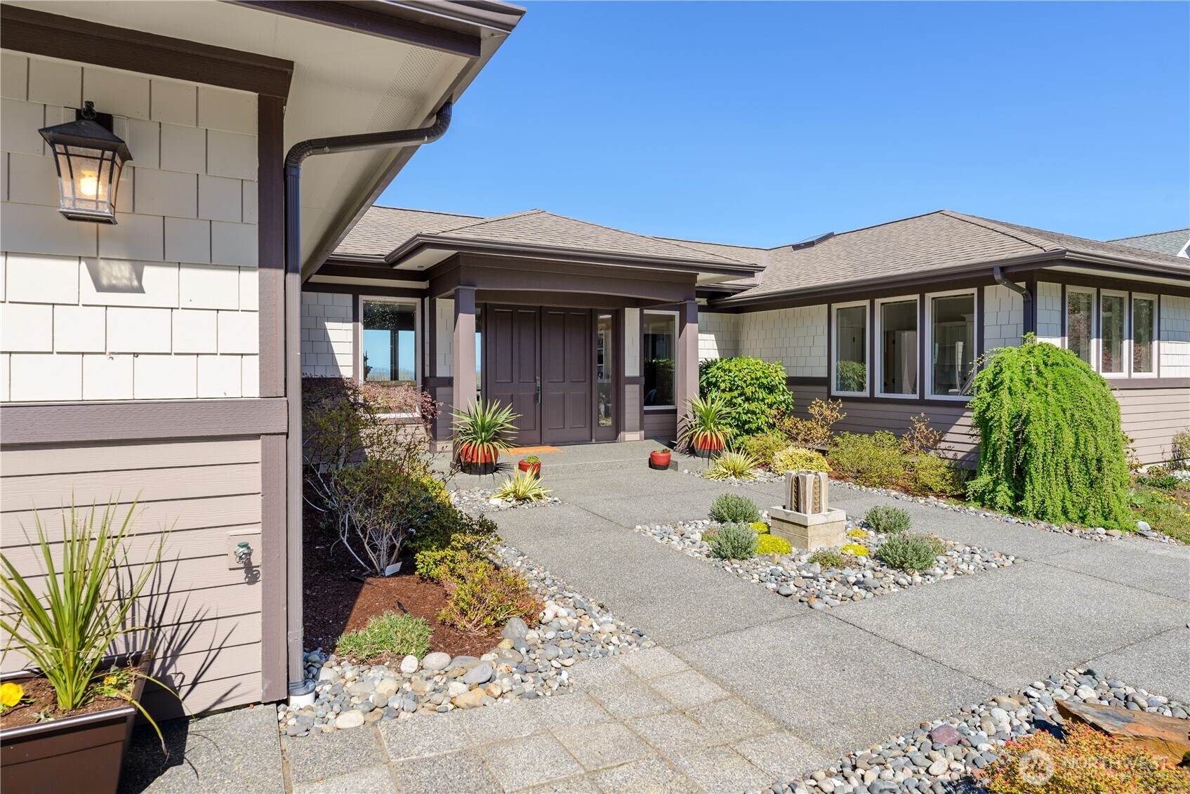 771 Brigadoon Boulevard Sequim, WA 98382 - Photo 6 of 40 a front view of a house with garden