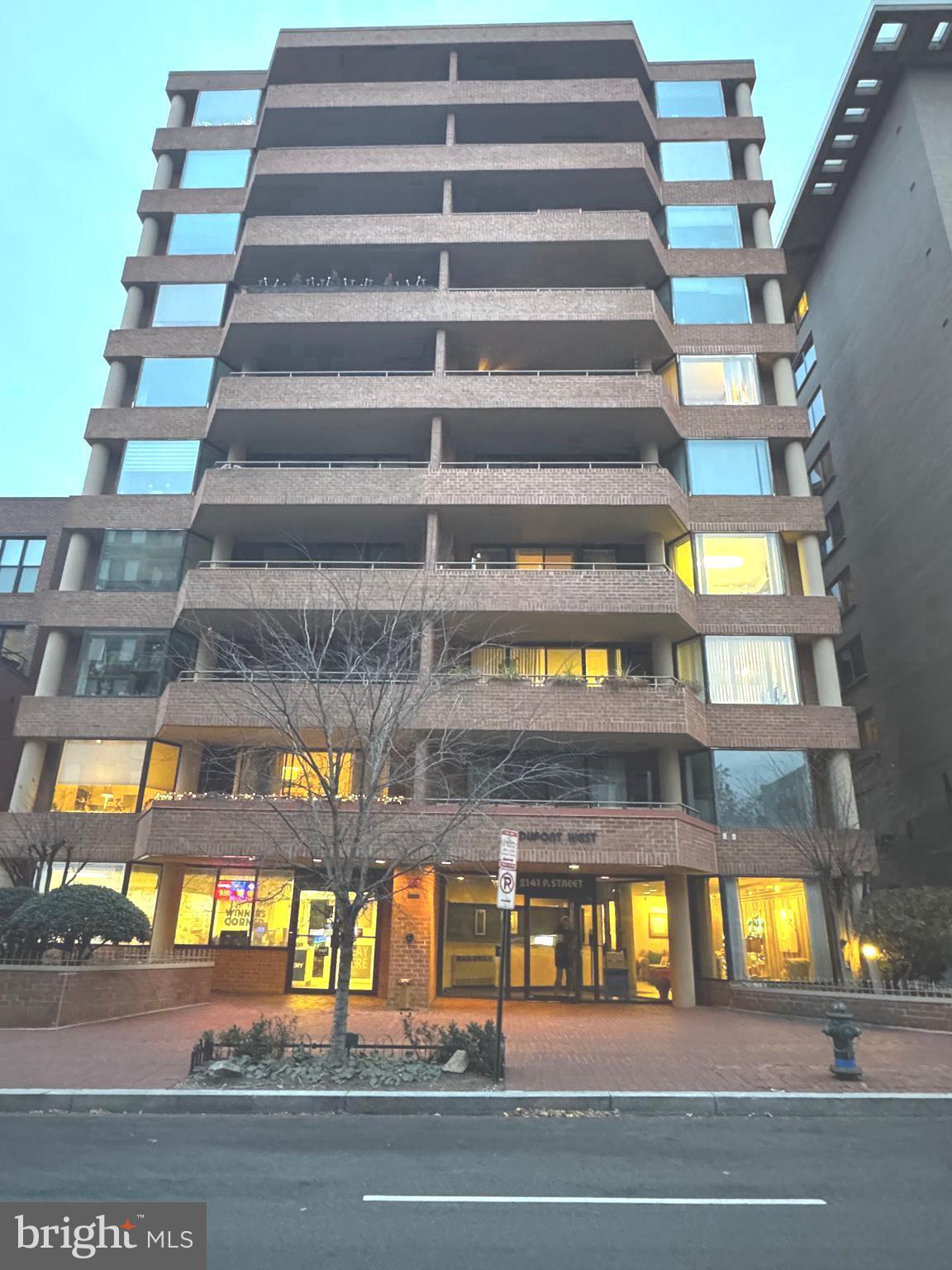 a view of a tall building from a ceiling window