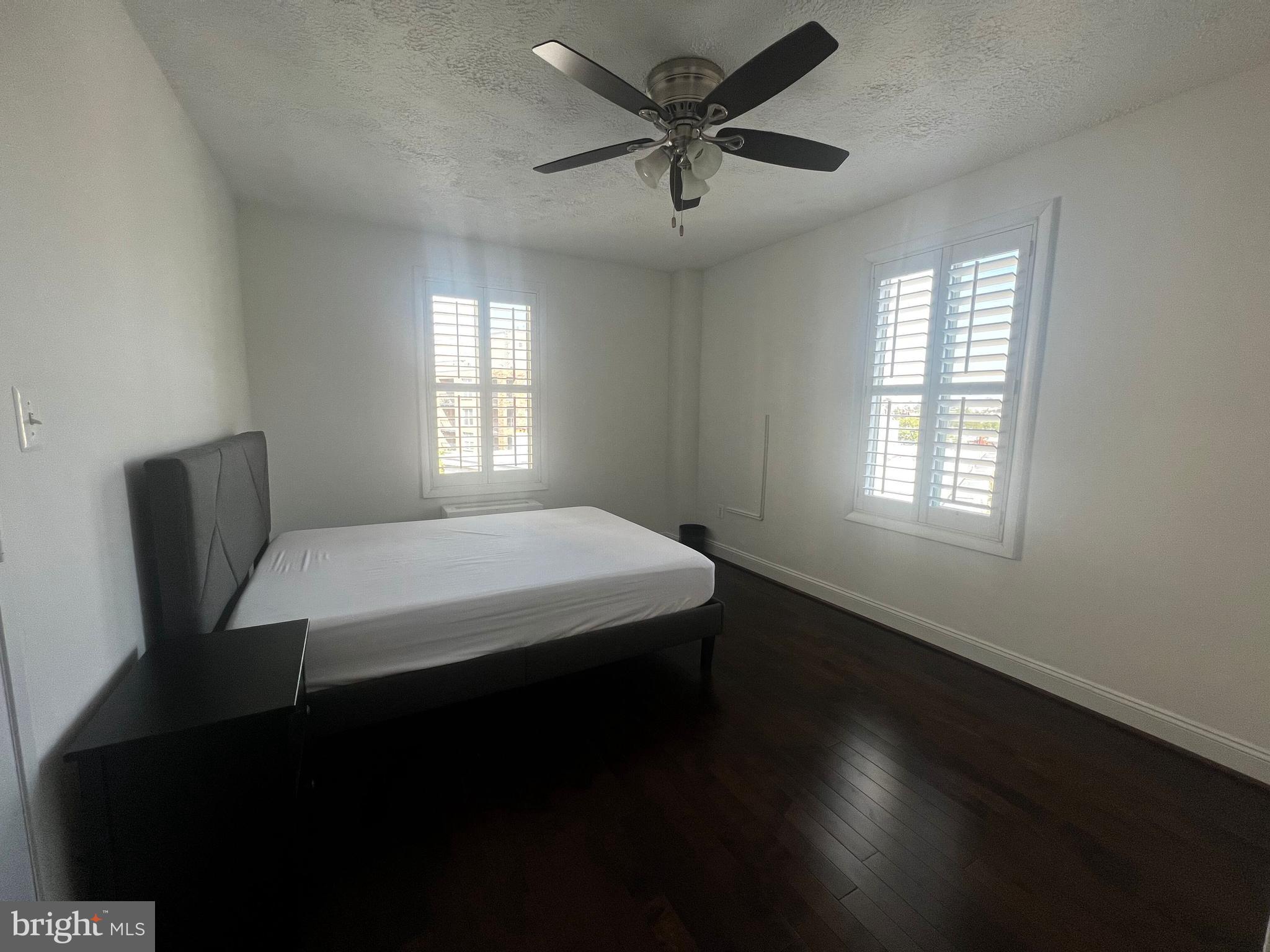 2141 P Street Northwest, Unit 705 Washington, DC 20037 - Photo 7 of 22 a bed sitting in a room next to a window