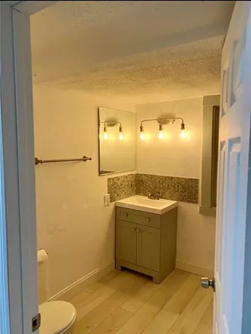 a living room with a couch and a window