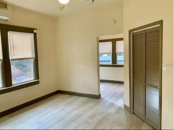 a kitchen with granite countertop cabinets and wooden floor