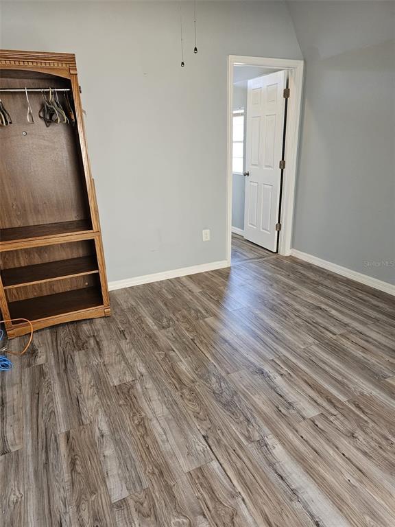 20805 Sheldon Street Orlando, FL 32833 - Photo 9 of 18 a view of an empty room with wooden floor and stairs