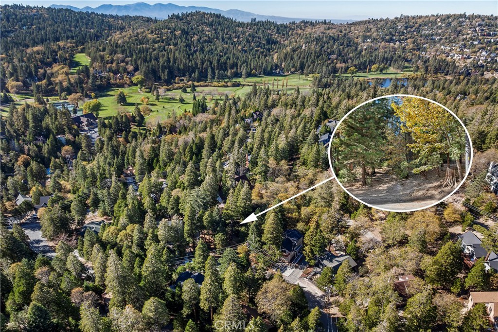 0 Pioneer Road Lake Arrowhead, CA 92352 - Photo 1 of 15 an aerial view of a house with a swimming pool and mountains