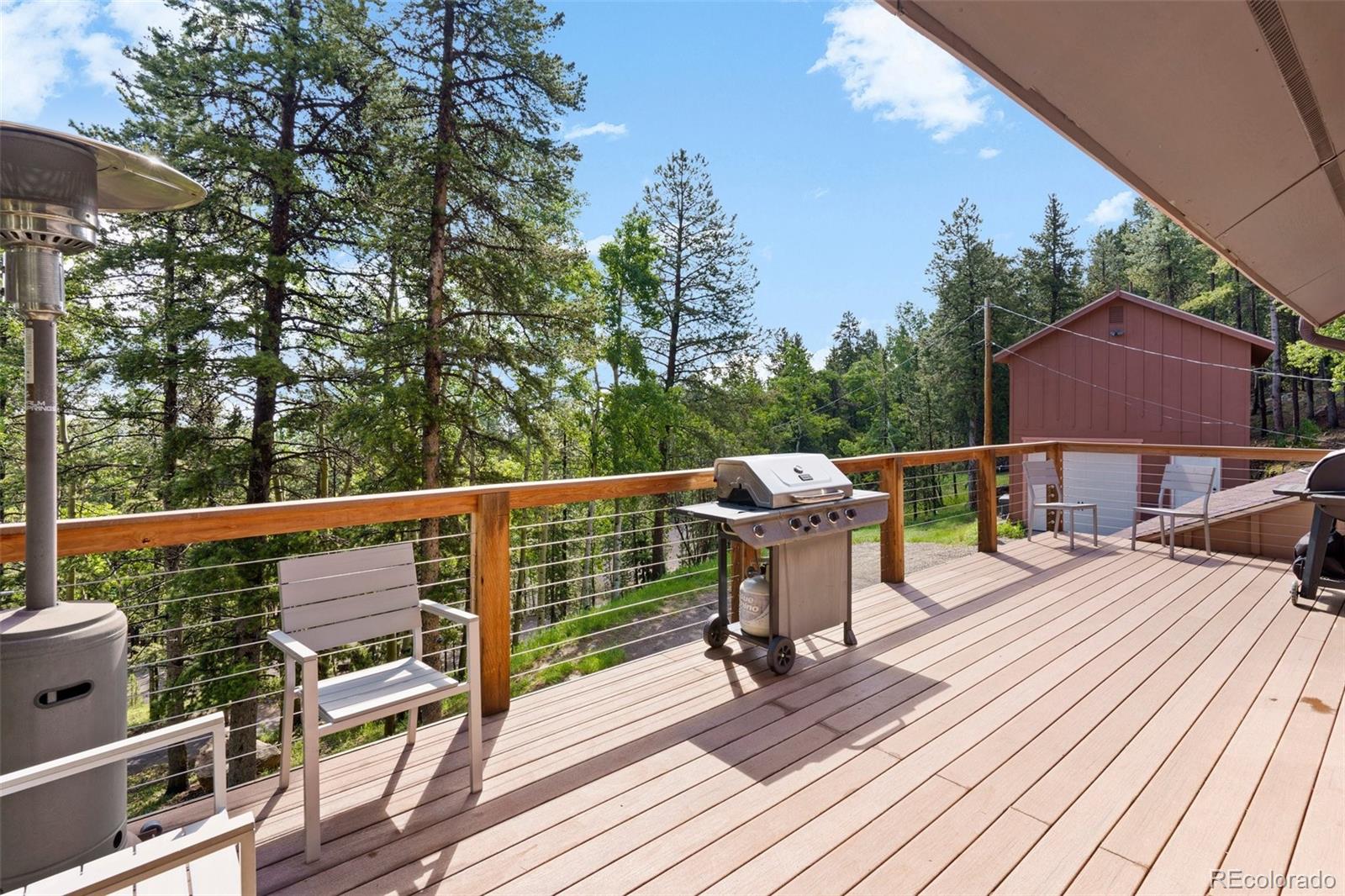 10807 Timothys Drive Conifer, CO 80433 - Photo 11 of 39 a view of roof deck with patio