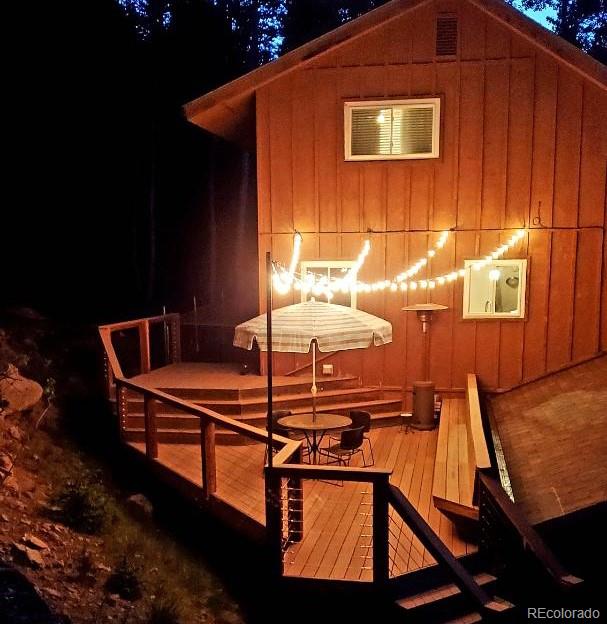 10807 Timothys Drive Conifer, CO 80433 - Photo 35 of 39 a balcony with view of the ocean