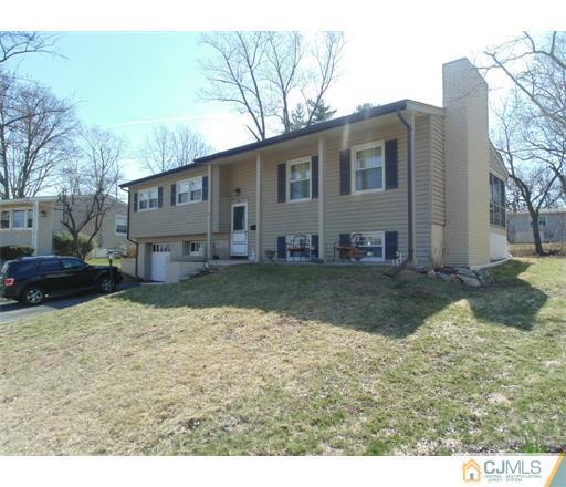 28 Bodnarik Road Edison, NJ 08837 - Photo 1 of 7 a view of a house with a yard covered in snow