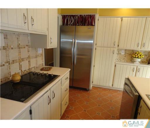 28 Bodnarik Road Edison, NJ 08837 - Photo 4 of 7 a kitchen with a sink and a refrigerator