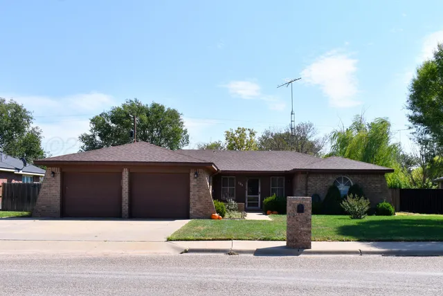 a front view of house with a yard
