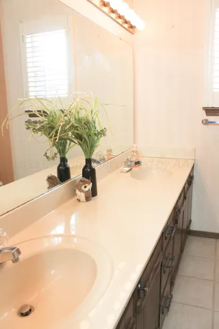 a bathroom with a toilet and a shower curtain