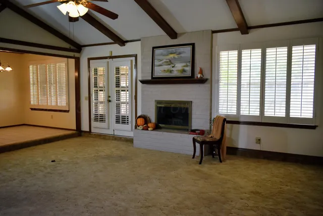 a view of a livingroom with furniture and a fireplace
