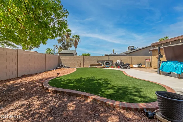 a backyard of a house with lots of green space