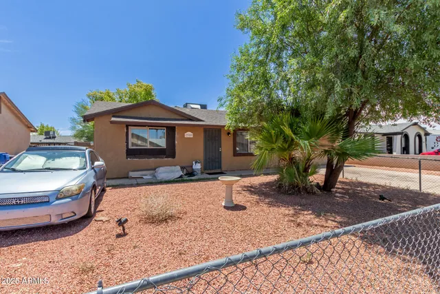 a front view of a house with yard and seating area
