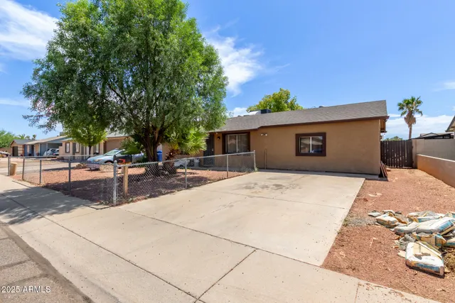 a view of a backyard with a patio