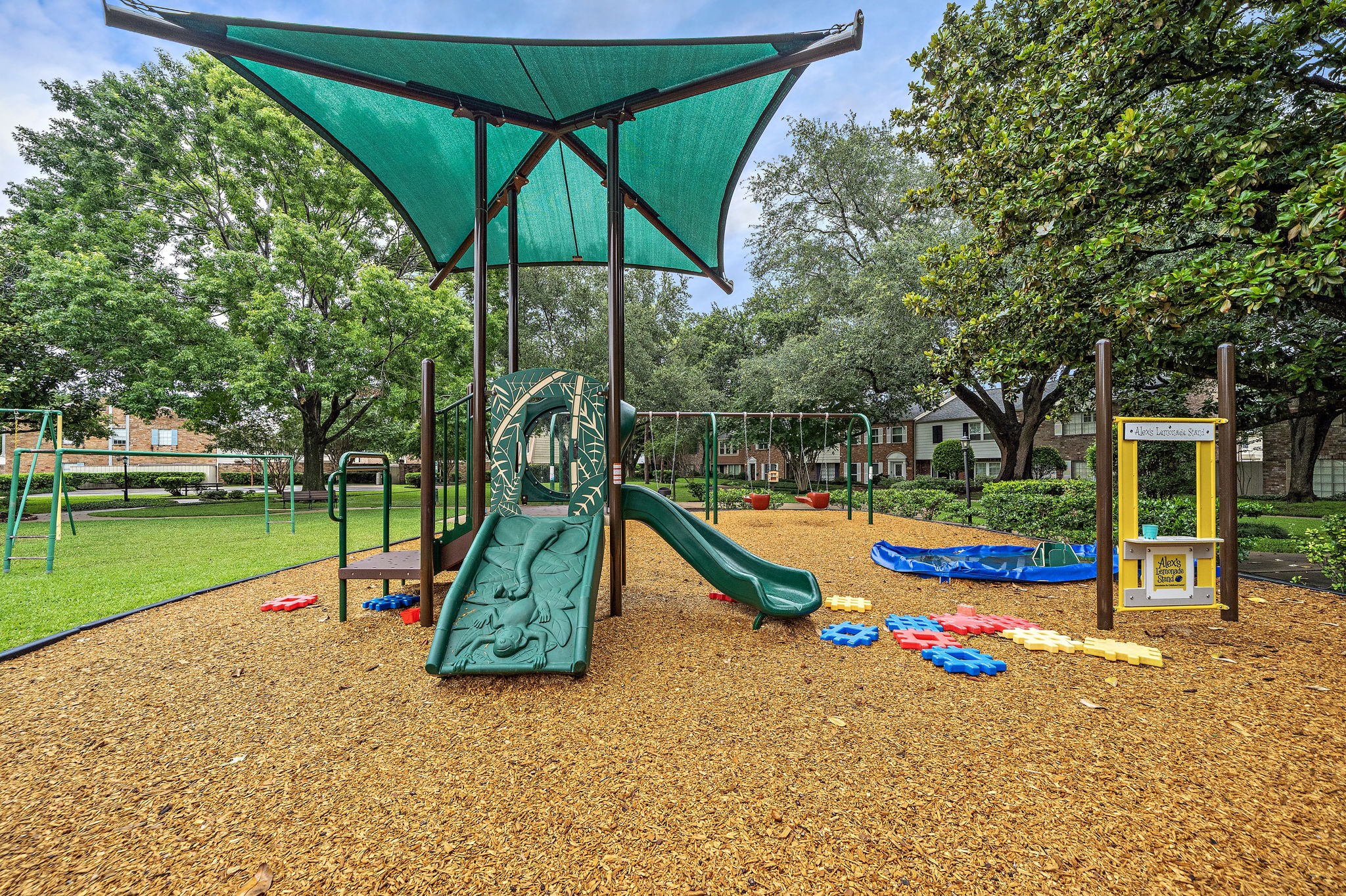 6452 Burgoyne Road, Unit 100 Houston, TX 77057 - Photo 35 of 44 a view of outdoor space with playground and green space