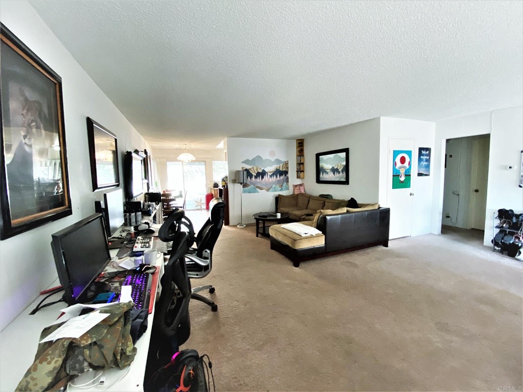 1121 Gardena Road Encinitas, CA 92024 - Photo 13 of 15 a living room with furniture a couch and a flat screen tv
