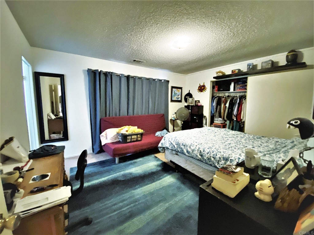 1121 Gardena Road Encinitas, CA 92024 - Photo 14 of 15 a bed room with a bed window and a chair