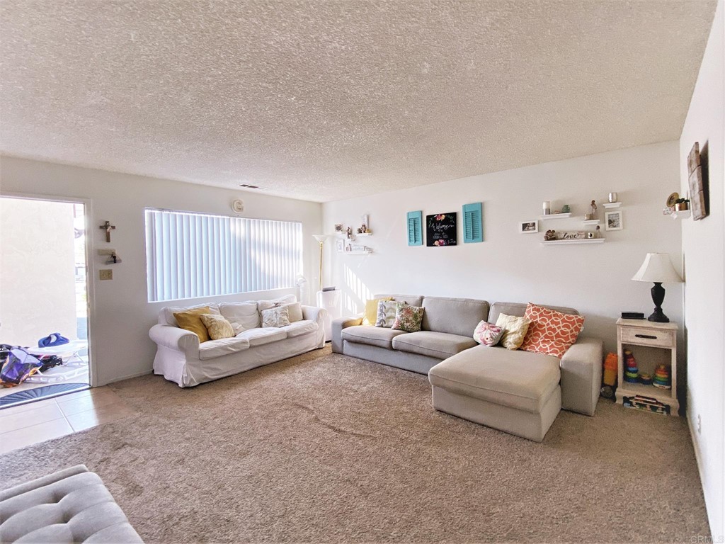1121 Gardena Road Encinitas, CA 92024 - Photo 5 of 15 a living room with furniture and a couch