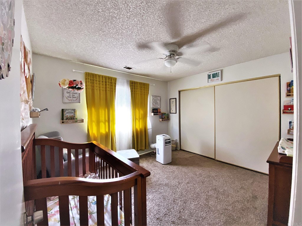 1121 Gardena Road Encinitas, CA 92024 - Photo 10 of 15 a view of an empty room with a window and hardwood floor