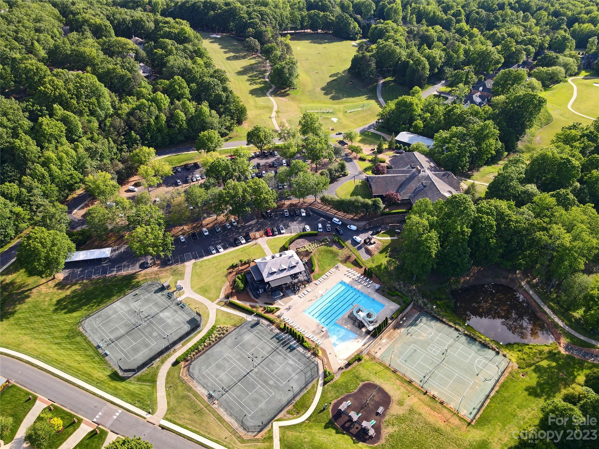 2909 Dodsworth Drive Cramerton, NC 28032 - Photo 4 of 9 an aerial view of a house with a garden and swimming pool