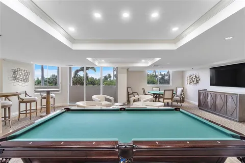 a room with lots of furniture and a large window