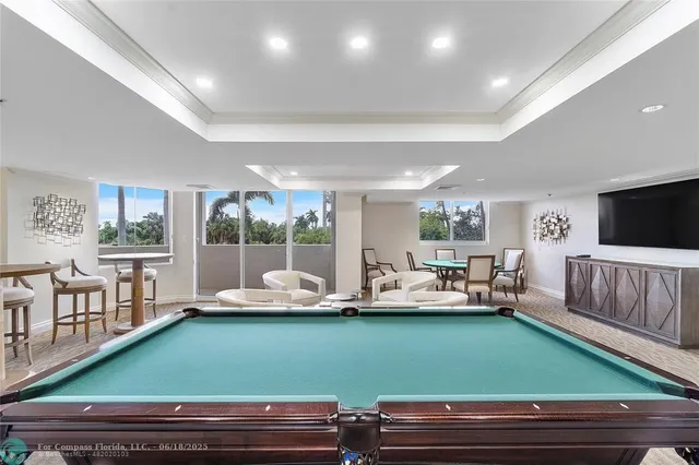 a room with lots of furniture and a large window