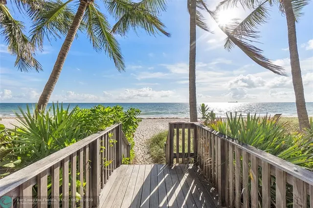a view of a balcony with wooden floor