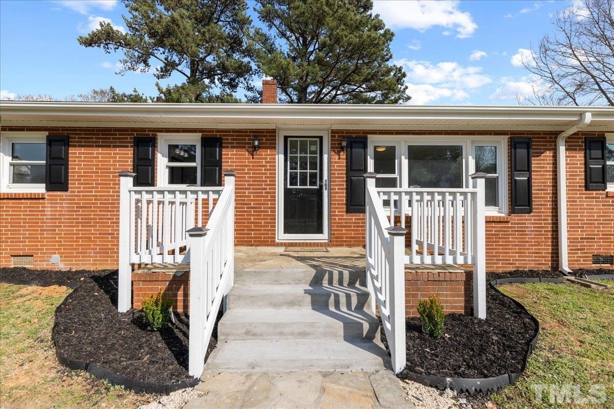 a front view of a house with a porch
