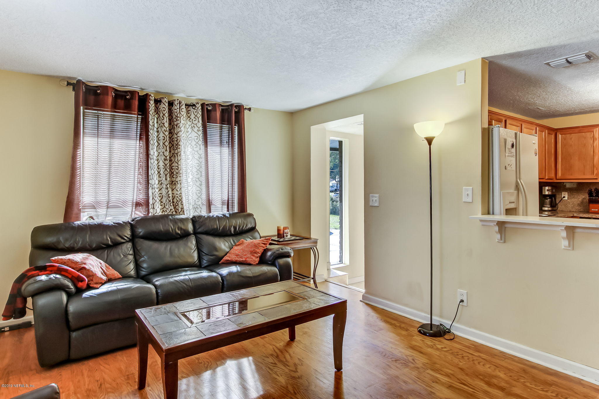 10321 Dobell Road Jacksonville, FL 32246 - Photo 11 of 34 a living room with furniture and a window
