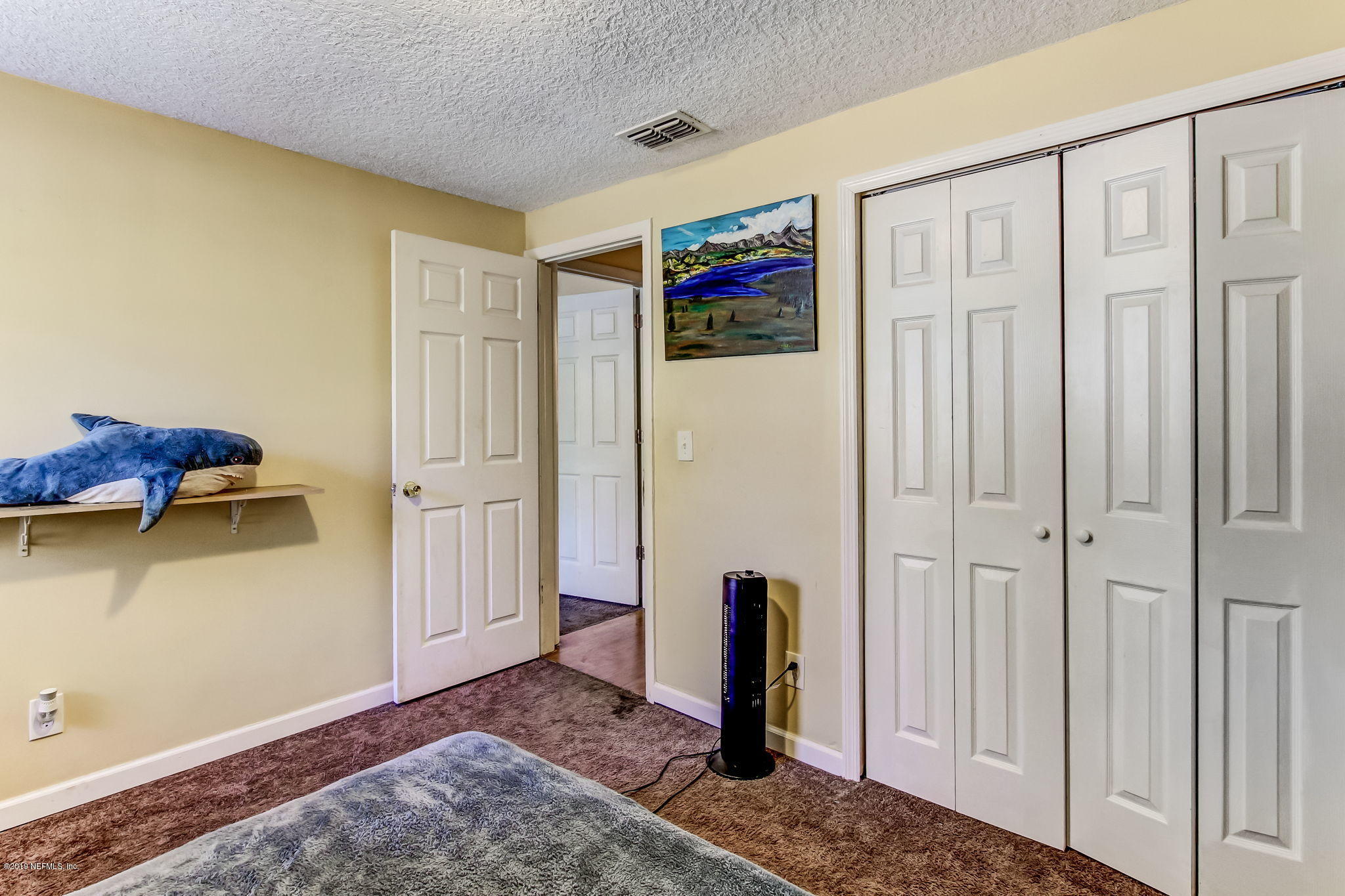 10321 Dobell Road Jacksonville, FL 32246 - Photo 23 of 34 a view of a hallway with closet area