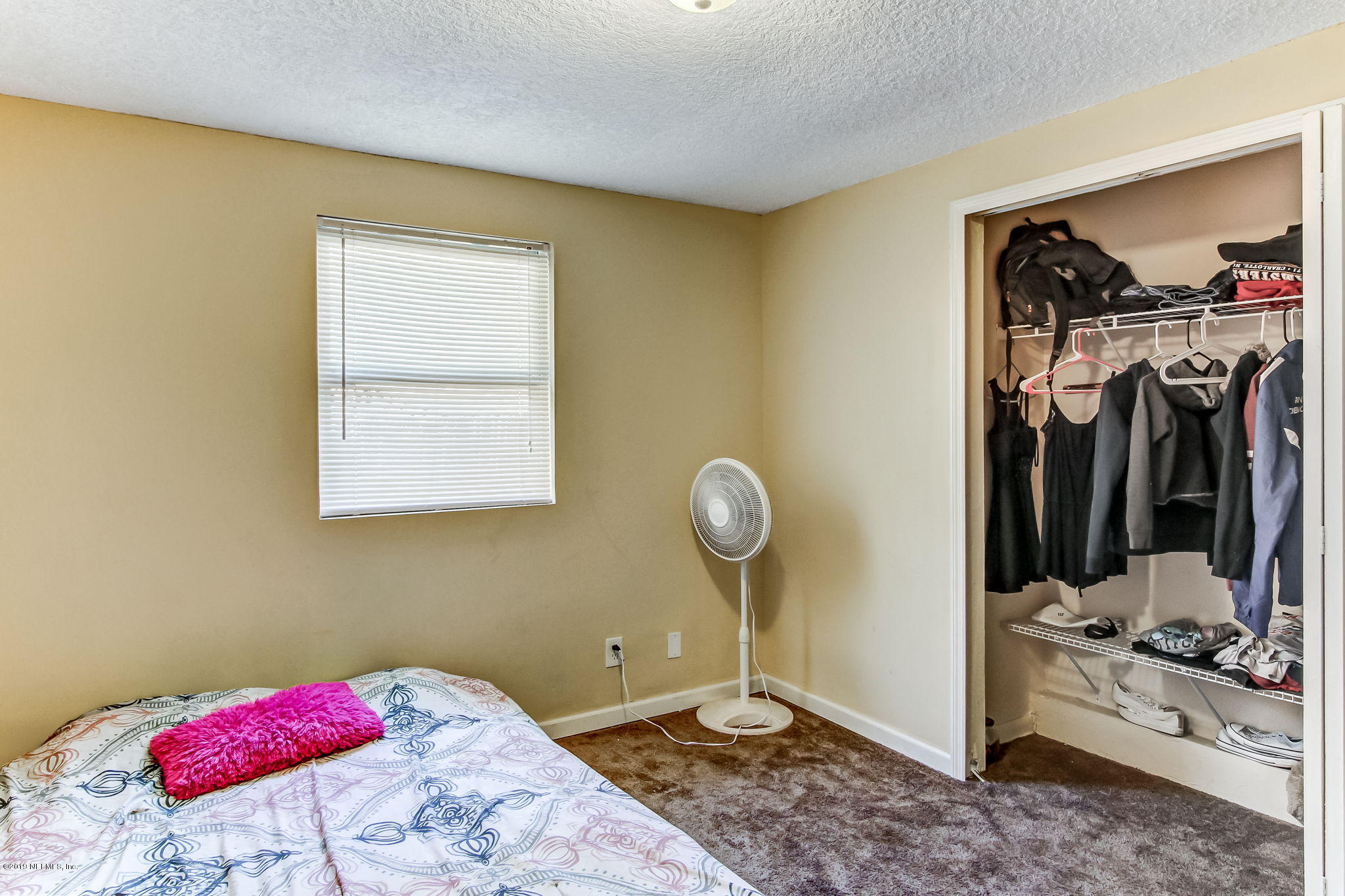 10321 Dobell Road Jacksonville, FL 32246 - Photo 25 of 34 a view of a bedroom with a window