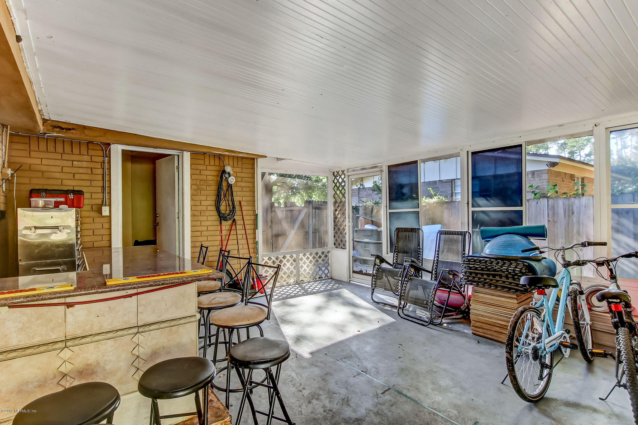 10321 Dobell Road Jacksonville, FL 32246 - Photo 29 of 34 a room with furniture and musical instruments