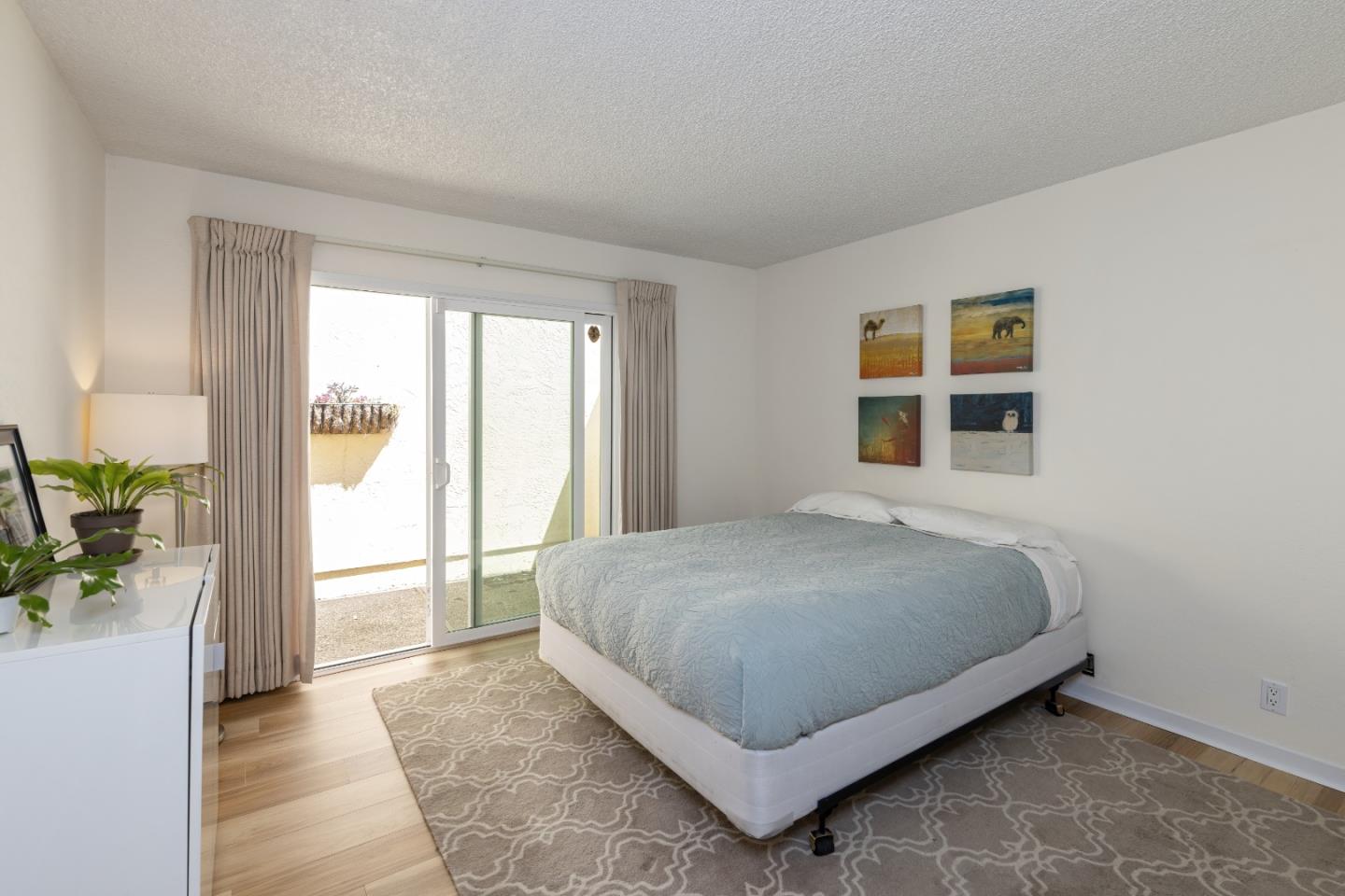 157 Oceanview Drive Watsonville, CA 95076 - Photo 11 of 25 a bed sitting in a bedroom next to a window