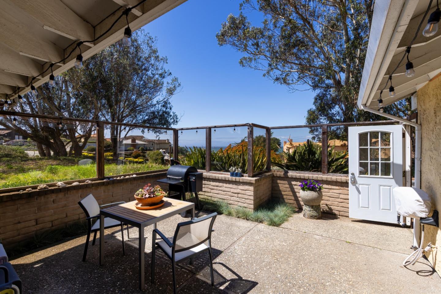 157 Oceanview Drive Watsonville, CA 95076 - Photo 13 of 25 a backyard of a house with a table and chairs
