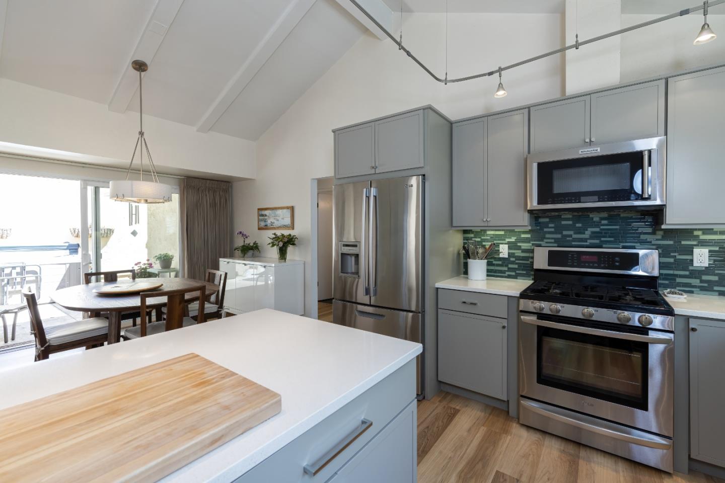 157 Oceanview Drive Watsonville, CA 95076 - Photo 2 of 25 a kitchen with a stove a refrigerator and a microwave
