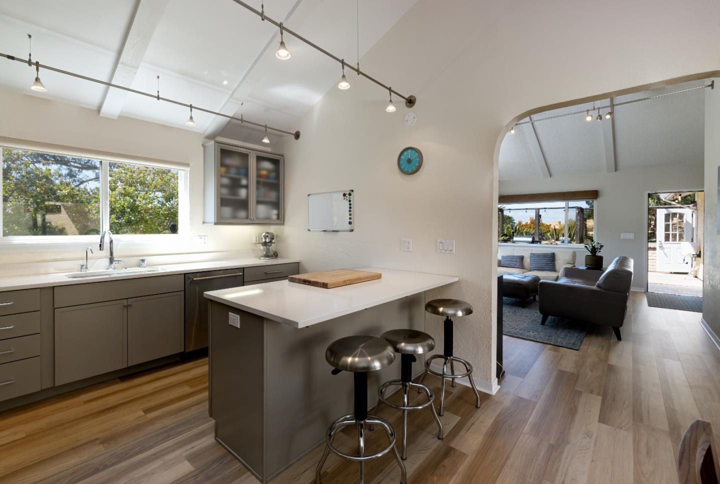 157 Oceanview Drive Watsonville, CA 95076 - Photo 3 of 25 a kitchen with sink cabinets and wooden floor