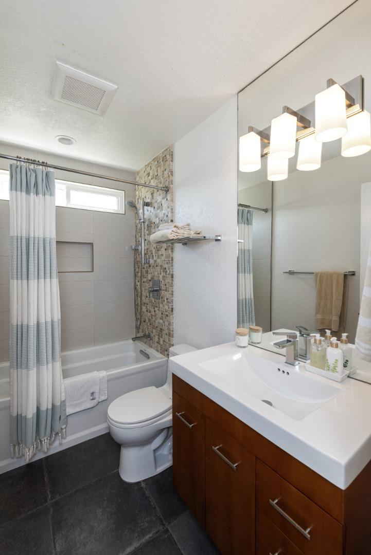 157 Oceanview Drive Watsonville, CA 95076 - Photo 8 of 25 a bathroom with a double vanity sink toilet and shower