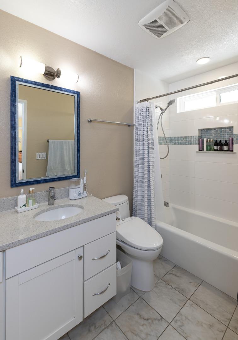 157 Oceanview Drive Watsonville, CA 95076 - Photo 9 of 25 a bathroom with a toilet sink and mirror