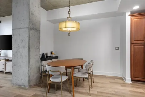 a dining room with furniture and chandelier