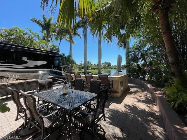 a view of a chairs and table in the patio