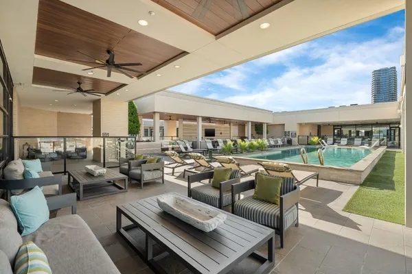 a patio with patio couch and chairs