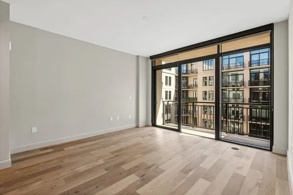 a view of an empty room with a window