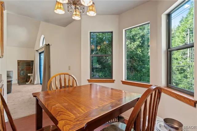a view of a dining room with furniture window and outside view