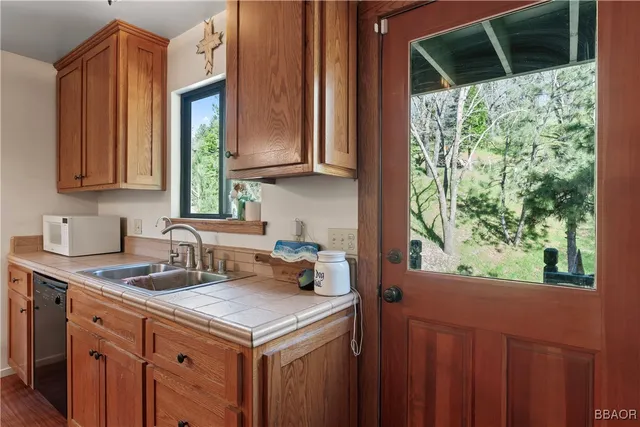 a kitchen with a sink and a window