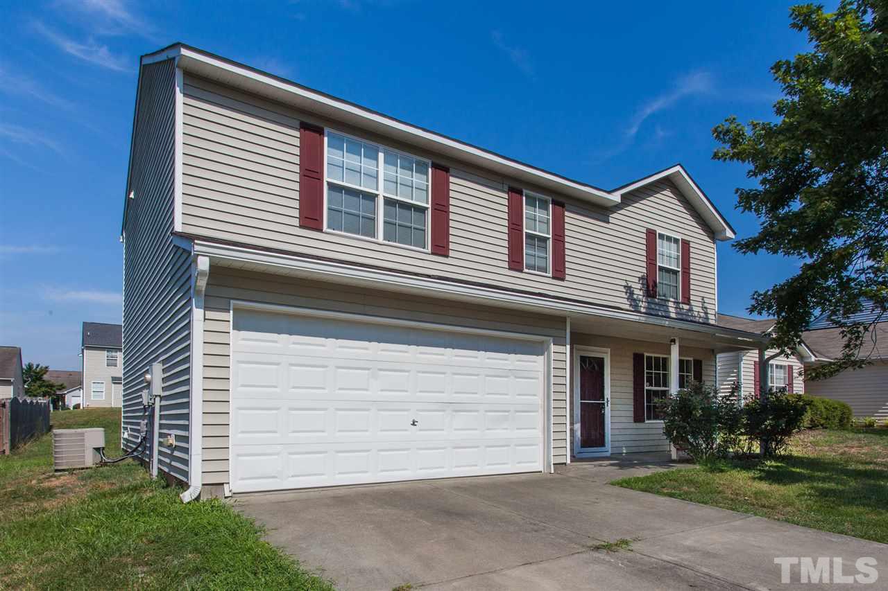 3628 Watkins Ridge Court Raleigh, NC 27616 - Photo 2 of 6 a front view of a house with a yard